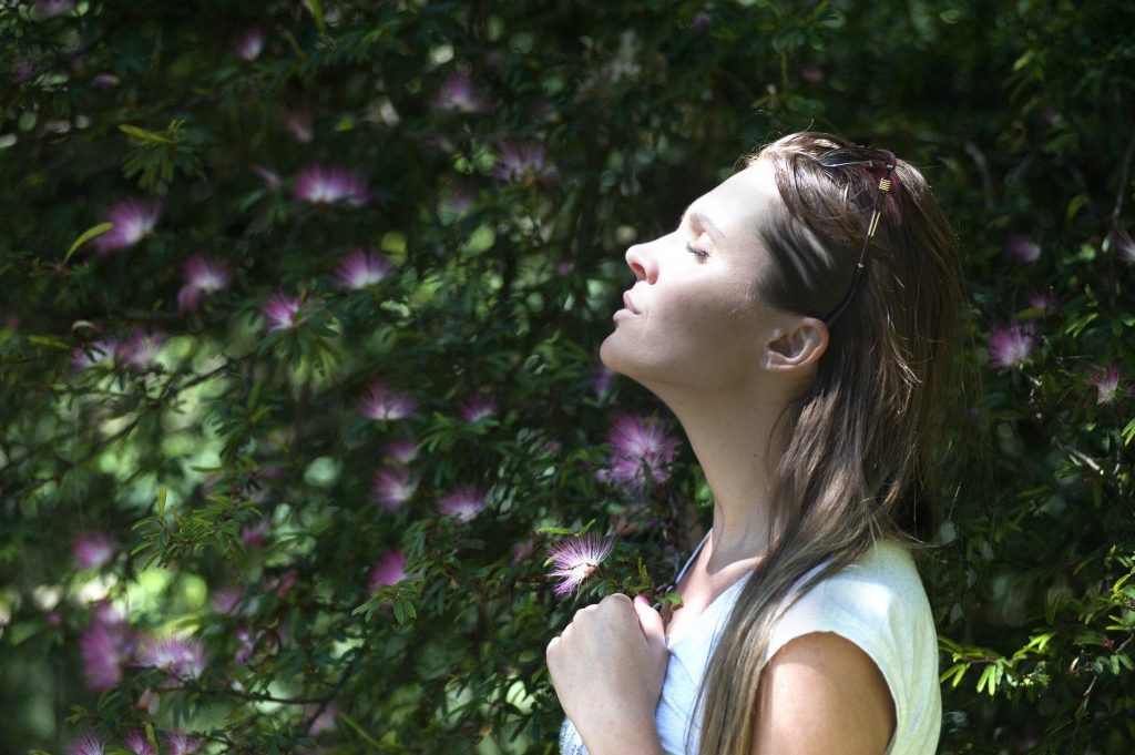 Woman breathing in and being mindful